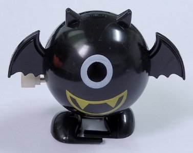Заводная игрушка Черный Летучий Мышь с золотым клювом